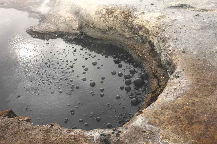 Bubbling mud pools at Hverir geothermal area in Myvatn, North Iceland