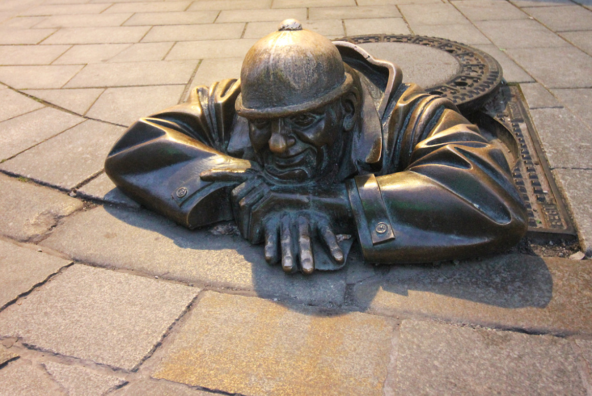 Cumil, the man peeking out from a sewage in Bratislava