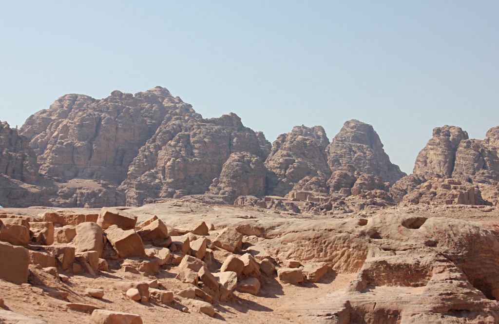 Surrounded by craggy conyons, rock formations Little Petra, desert, Jordan