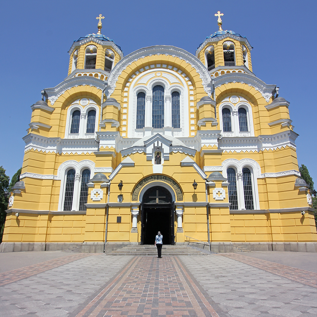 The bright yellow facade of Volodymr's Cathedral in Kyiv, Ukraine