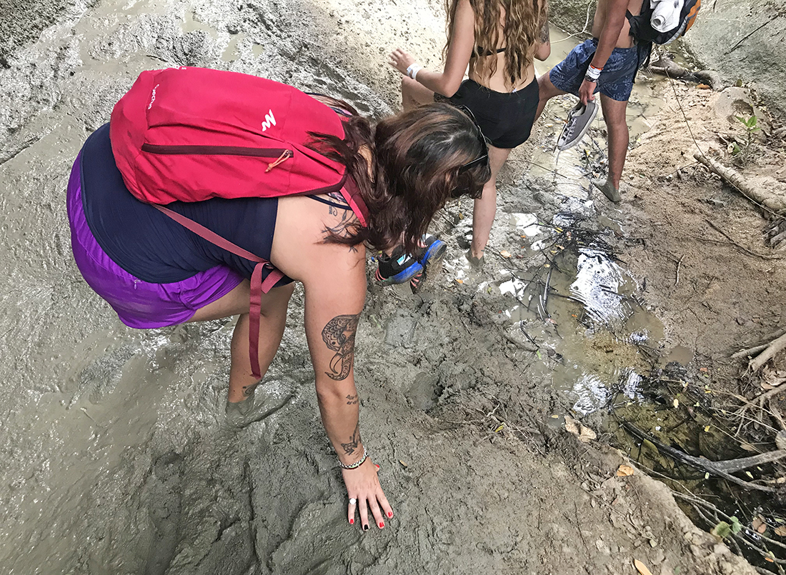 Hiking through mud in Tayrona National Park, Colombia
